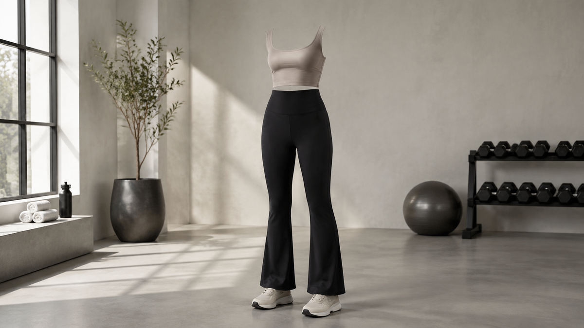 Black flare leggings displayed in a bright fitness studio