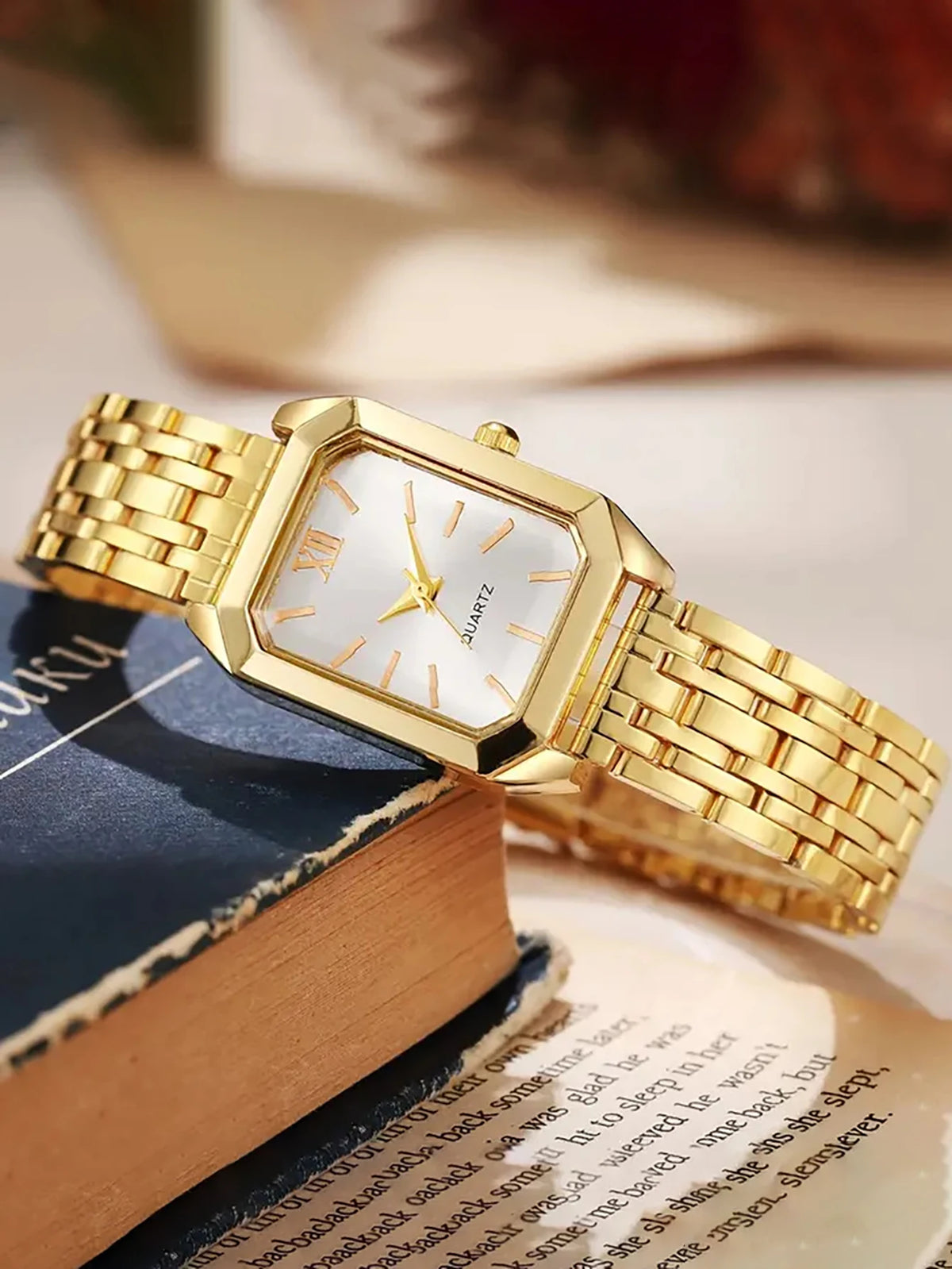 A lady's compact quartz watch and a set of hollowed-out and jeweled decorations, suitable as a holiday gift, without the box.