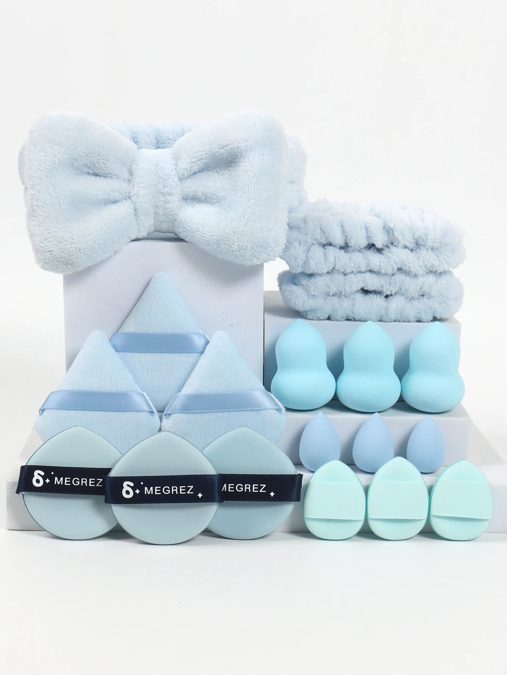18 Piece Headband Set. 1 Hair Band & 2 Wrist Bands & 3 Make-Up Sponges & 3 Mini Square Air Cushions & 3 Triangular Powder Puff &