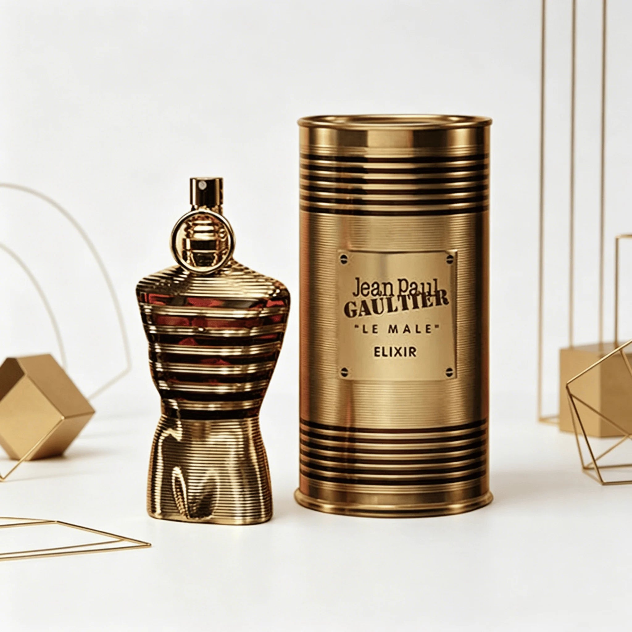 Jean Paul Gaultier Le Male Elixir EDP 75ML Perfume For Men Warm Vanilla Cardamom Woody Aroma Long Lasting Shiny Gold Metallic Striped Body Bottle With Gold Ring Cap Complete Gold Tin Box Dating Anniversary Present