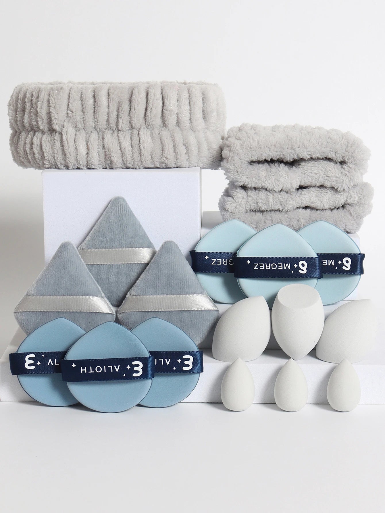 18 Piece Headband Set. 1 Hair Band & 2 Wrist Bands & 3 Make-Up Sponges & 3 Mini Square Air Cushions & 3 Triangular Powder Puff &