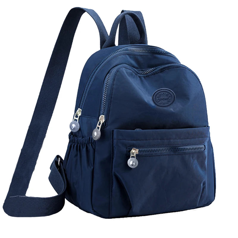 Neutral Style Backpack for Men and Women, Suitable for Travel and Photography Made of Nylon Material, with a Round Logo Design.