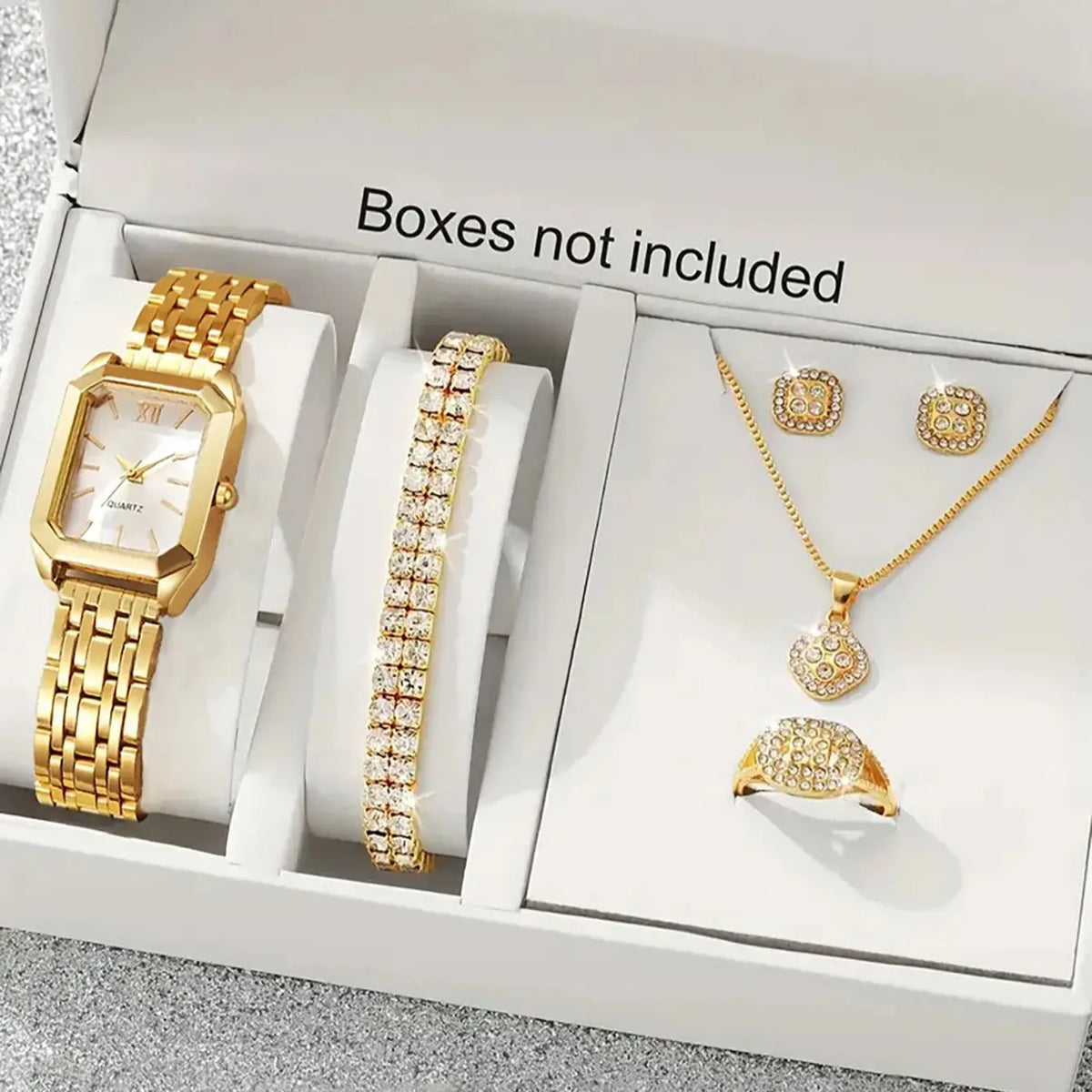 A lady's compact quartz watch and a set of hollowed-out and jeweled decorations, suitable as a holiday gift, without the box.