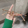 A pair of full-rim square glasses with metal frame and AC lenses simple decoration style