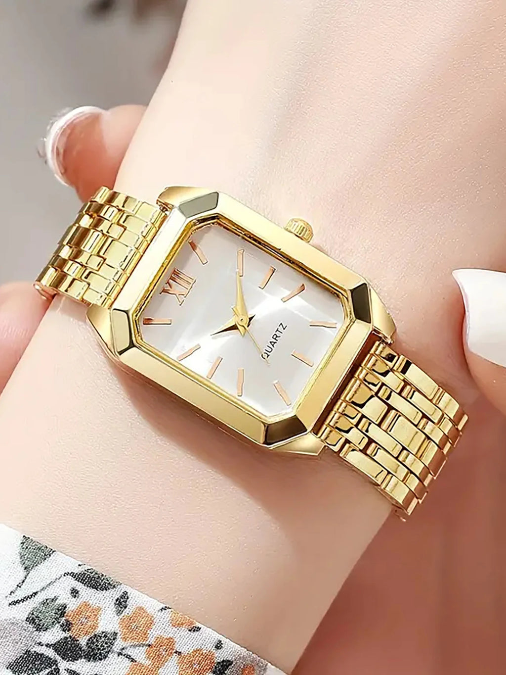 A lady's compact quartz watch and a set of hollowed-out and jeweled decorations, suitable as a holiday gift, without the box.