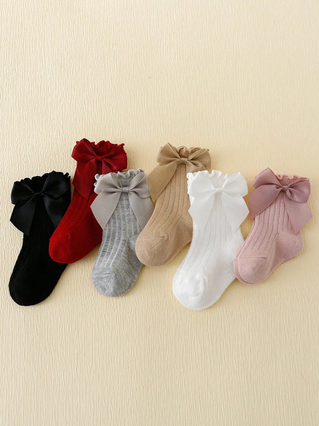 6 pairs of Rowan Bow lace baby bubble mouth socks
