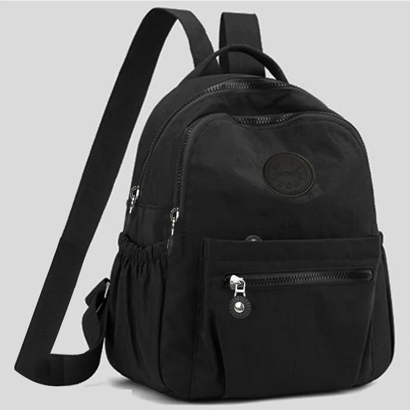 Neutral Style Backpack for Men and Women, Suitable for Travel and Photography Made of Nylon Material, with a Round Logo Design.