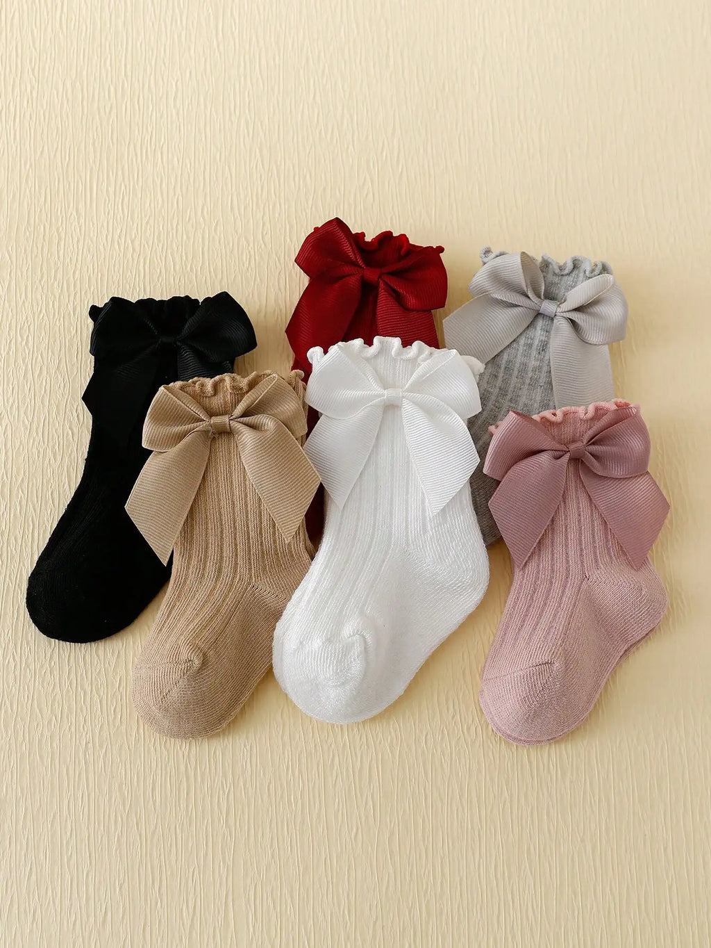 6 pairs of Rowan Bow lace baby bubble mouth socks