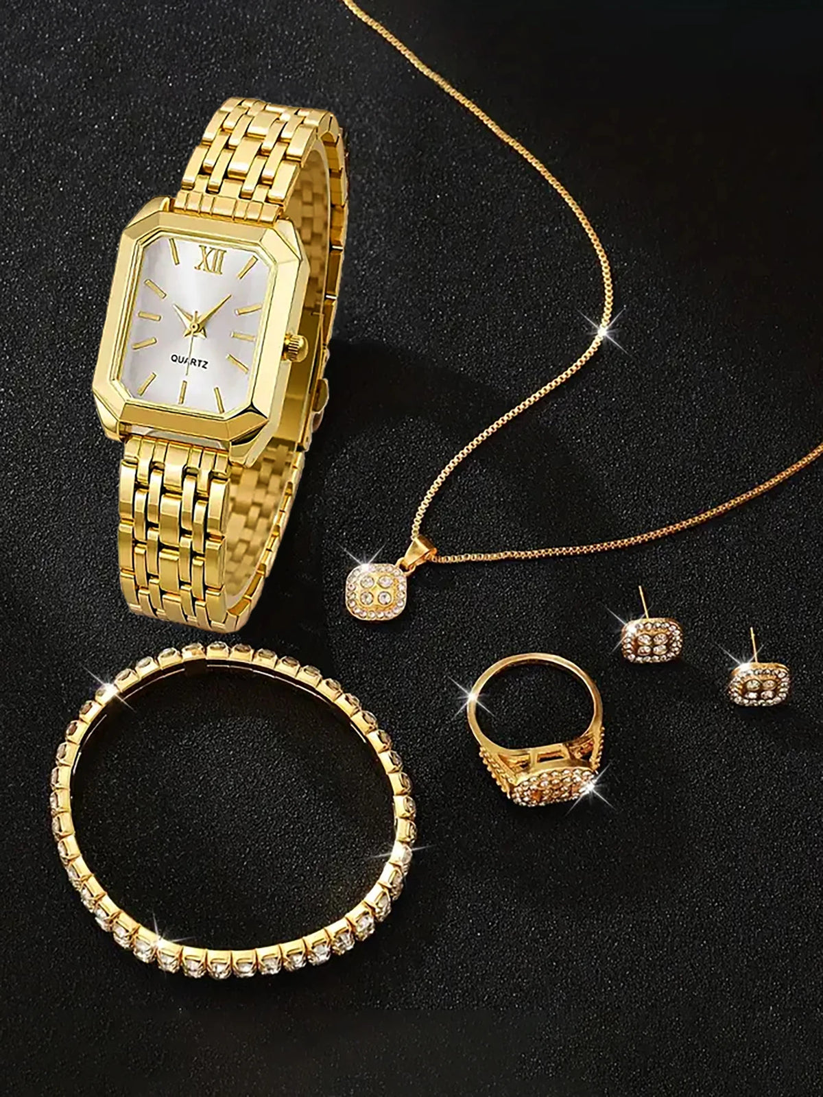 A lady's compact quartz watch and a set of hollowed-out and jeweled decorations, suitable as a holiday gift, without the box.