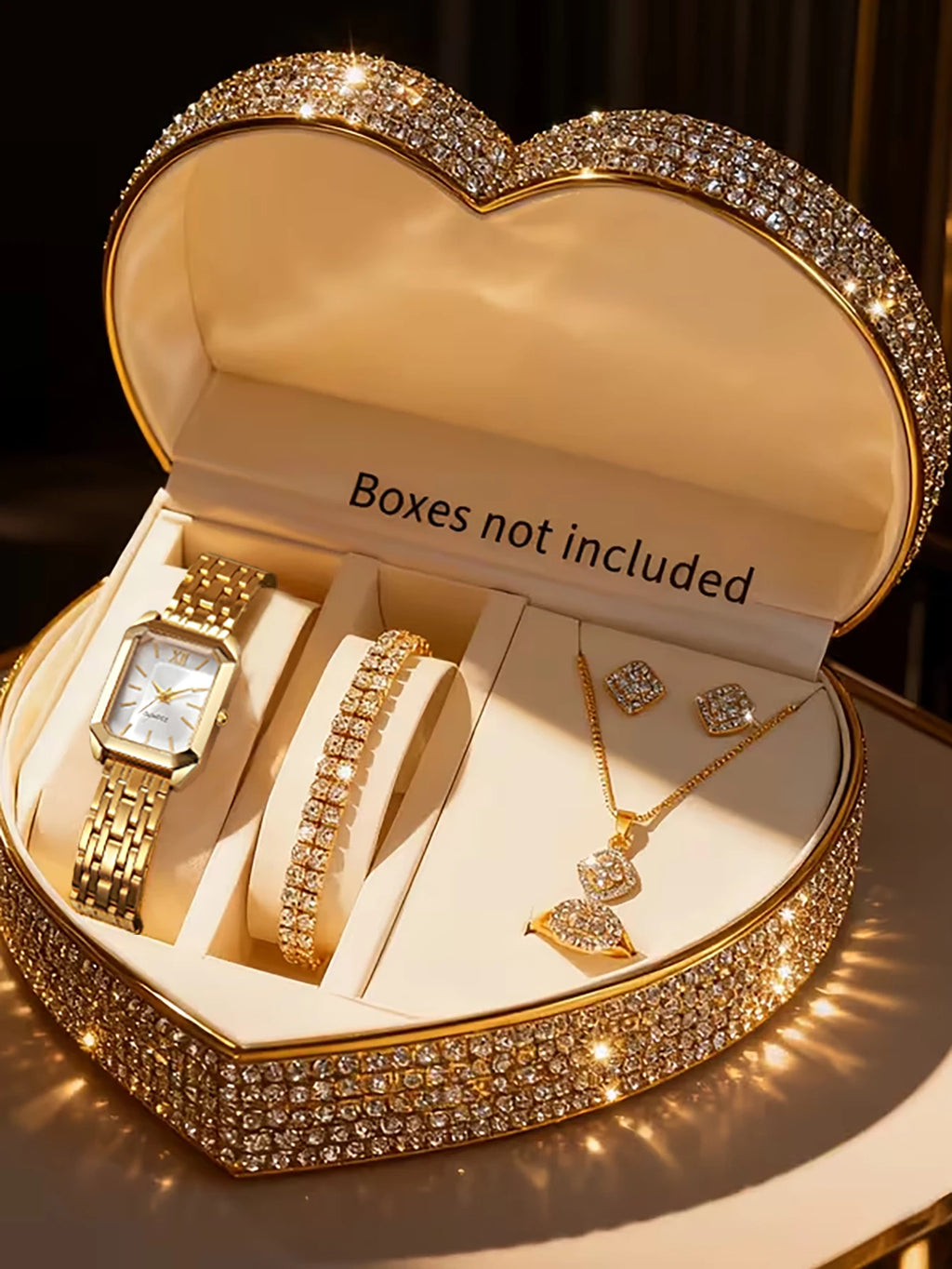 A lady's compact quartz watch and a set of hollowed-out and jeweled decorations, suitable as a holiday gift, without the box.